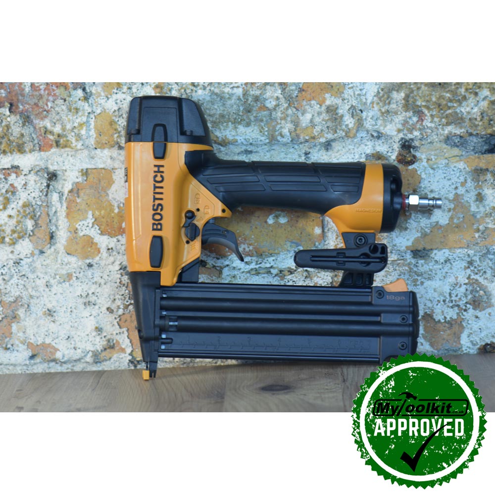 Stanley Bostitch 18 Gauge Brad Nailer (15-50mm) BT1855-E against a brick wall