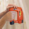 Someone using a Tacwise 53-13EL Cordless 12V Stapler (1565) to fix plastic sheeting to a wall