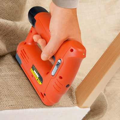 Someone using a Tacwise 53-13EL Cordless 12V Stapler (1565) to upholster a stool.