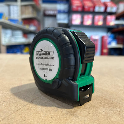 A Tape Measure with thumb locking system and rubber casing with MyToolkit Stapling and Nailing 5m on the front