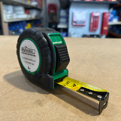 A Tape Measure with a yellow blade and rubber casing with MyToolkit Stapling and Nailing 5m on the front